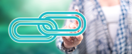 Woman touching a link concept on a touch screen with her fingerの写真素材