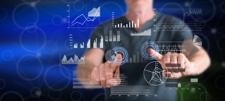 Man touching a financial analysis concept on a touch screen with his fingers