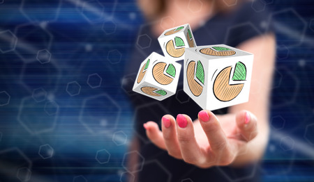 Business chart concept above the hand of a woman in backgroundの写真素材