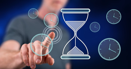 Man touching a time management concept on a touch screen with his finger