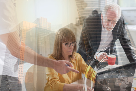 Business people working together in office, light effect, double exposureの写真素材