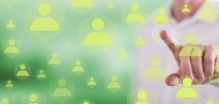 Man touching a social network concept on a touch screen with his fingerの写真素材