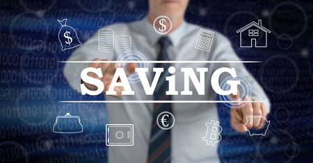 Man touching a saving concept on a touch screen with his fingersの写真素材