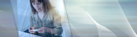 Mature woman using a mobile phone at home, double exposure, light effect. panoramic bannerの写真素材