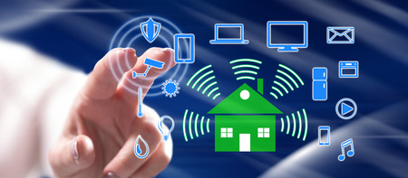 Woman touching a smart home concept on a touch screen with her finger