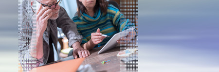 Senior business people working on tablet in office. panoramic banner
