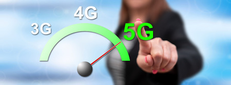 Woman touching a 5g concept on a touch screen with her finger