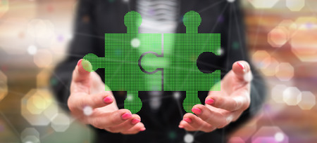 Partnership concept above the hands of a woman in backgroundの写真素材