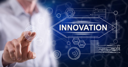 Man touching an innovation concept on a touch screen with his fingerの写真素材