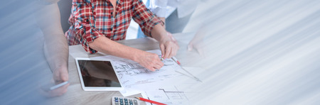 Architects working on plans at office. panoramic bannerの写真素材