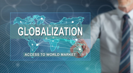 Man touching a globalization concept on a touch screen with his fingerの写真素材