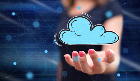 Cloud networking concept above the hand of a woman in background