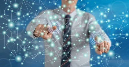 Man touching a virtual network on a touch screen with his fingers