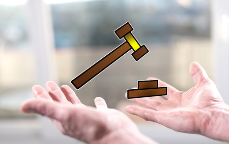 Judgment concept above the hands of a manの写真素材