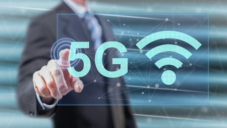 Man touching a 5g concept on a touch screen with his fingers