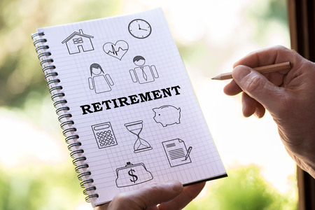 Hand drawing retirement concept on a notepadの写真素材