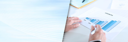 Analyzing growing results on a graphic. panoramic bannerの写真素材