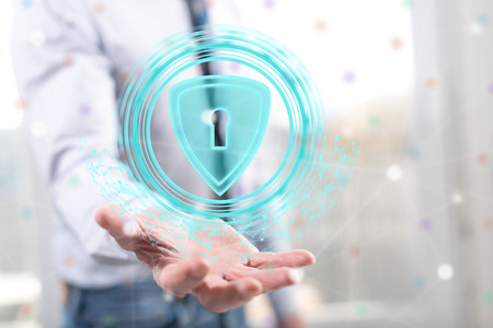 Data security concept above the hand of a man in background