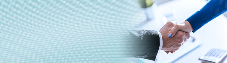 Handshake between businesswoman and businessman. panoramic bannerの写真素材