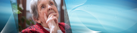 Thoughtful senior woman looking up. panoramic bannerの写真素材