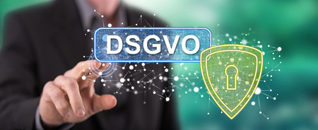 Man touching a gdpr concept (german text dsgvo) on a touch screen with his fingerの写真素材