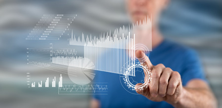 Man touching a financial analysis concept on a touch screen with his finger