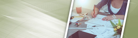 Architect working on plans at office, light effet. panoramic banner