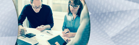 Business people working together in office, post processing. panoramic banner