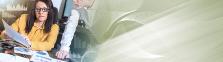Young businesswoman and senior businessman working together at office. panoramic bannerの写真素材