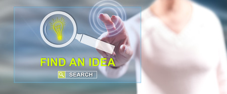 Woman touching an idea search concept on a touch screen with her fingersの写真素材