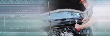 Car mechanic repairing a car engine. panoramic bannerの写真素材