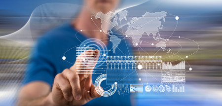 Man touching a global business digital interface concept on a touch screen with his finger