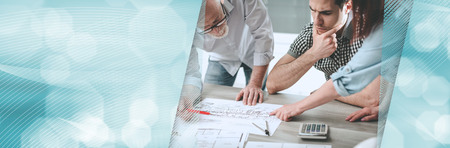 Architects working on plans at office. panoramic bannerの写真素材