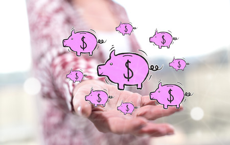 Saving concept above the hand of a woman in backgroundの写真素材