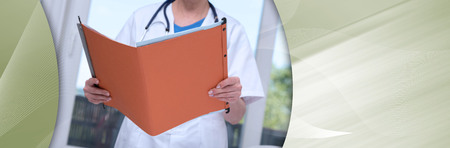 Female doctor holding a file in medical office. panoramic bannerの写真素材