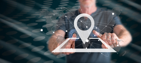 Man touching a gps concept on a touch screen with his fingersの写真素材