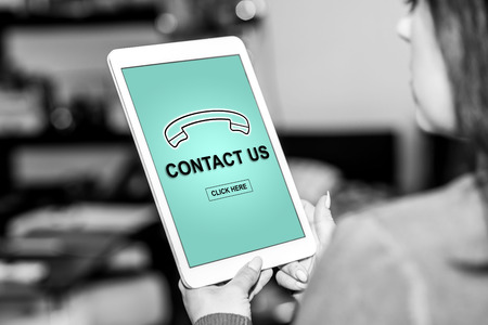 Tablet screen displaying a phone support conceptの写真素材