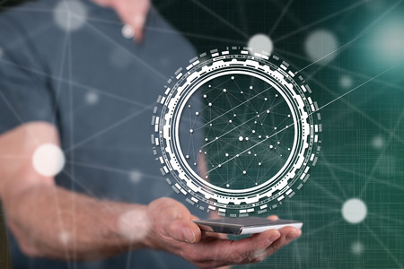 Digital technology concept above a smartphone held by a man in background
