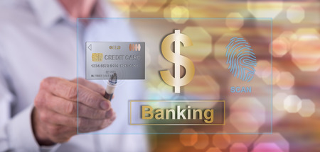 Man touching a banking security concept on a touch screen with a penの写真素材
