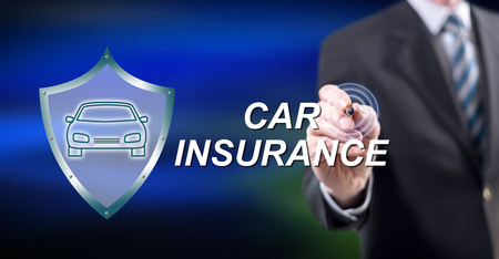 Man touching a car insurance concept on a touch screen with a stylus penの写真素材