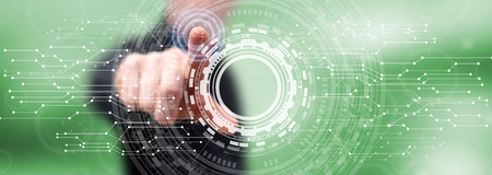 Man touching a virtual technology concept on a touch screen with his finger