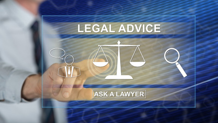 Man touching a legal advice concept on a touch screen with his fingerの写真素材