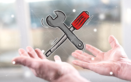 Maintenance service concept above the hands of a manの写真素材