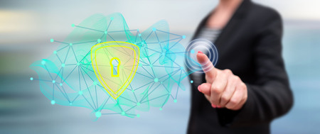 Woman touching a data security concept on a touch screen with her finger