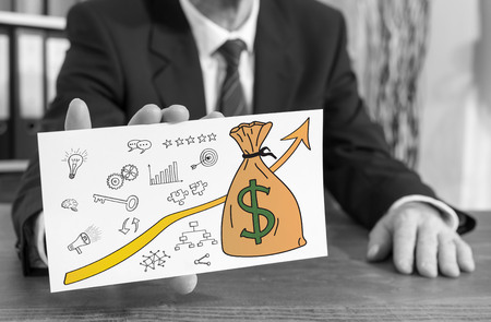 Businessman showing an index card with business success conceptの写真素材