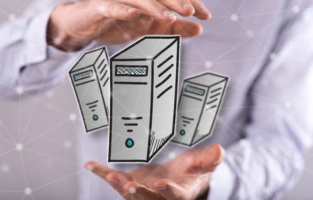 Desktop computer concept between hands of a man in background
