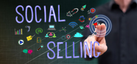 Man touching a social selling concept on a touch screen with his fingersの写真素材