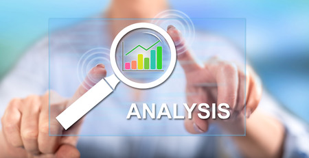 Woman touching analysis concept on a touch screen with her fingersの写真素材