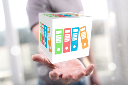 Data storage concept above the hand of a man in backgroundの写真素材