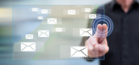 Man touching email concept on a touch screen with his fingers